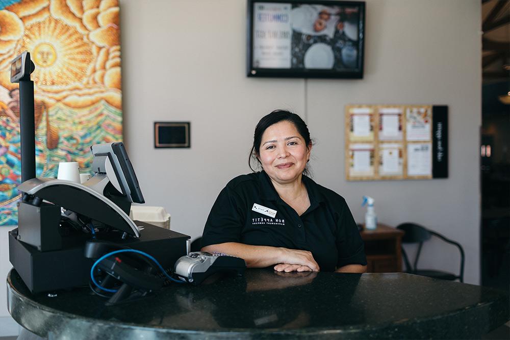 Aracely greets students each day in the Caf.